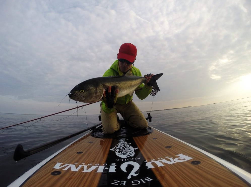 Sean Callinan fly fishing on Pau Hana angler SUP