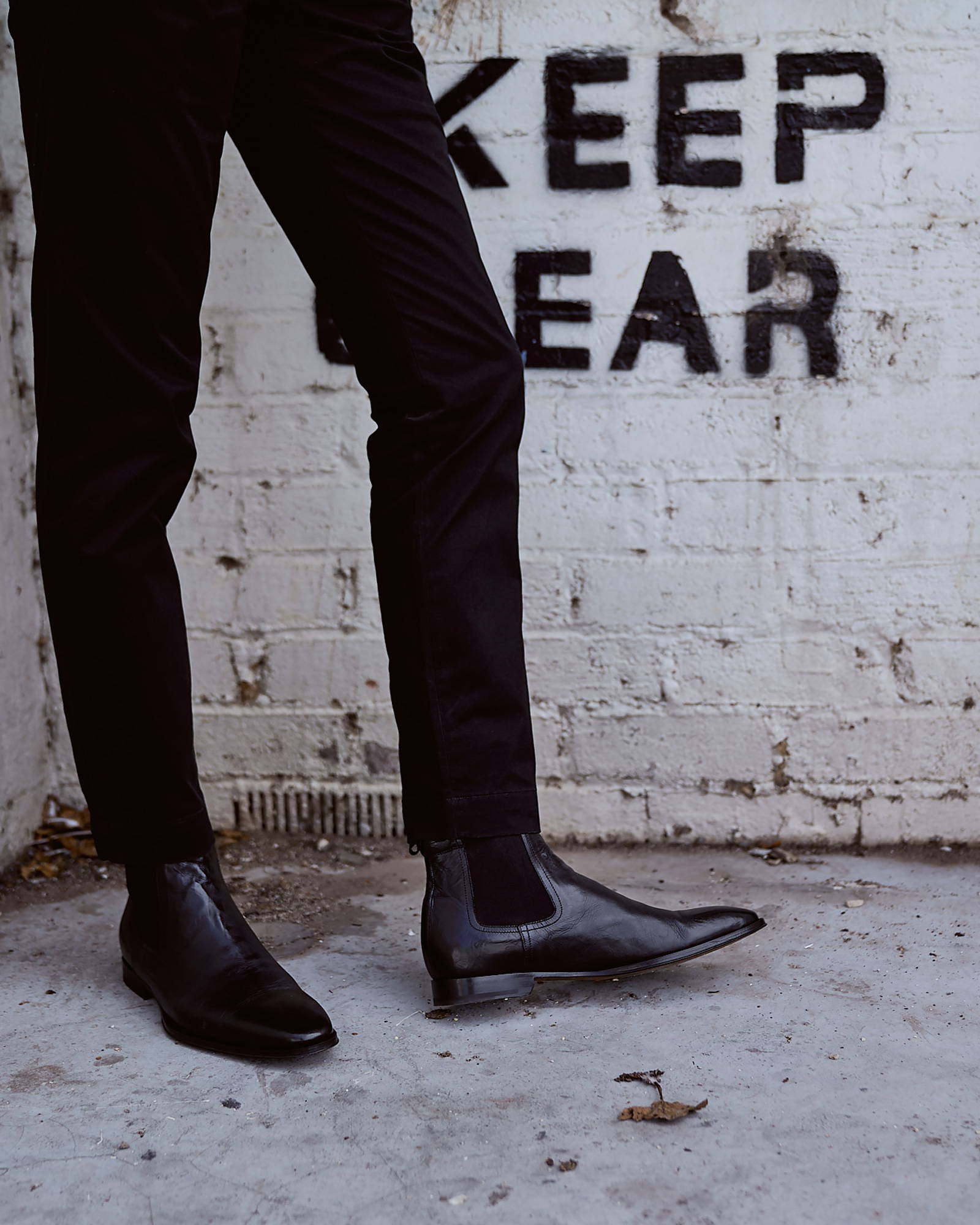 The Osbourne 2.0 Black Chelsea Boots worn with a black pant