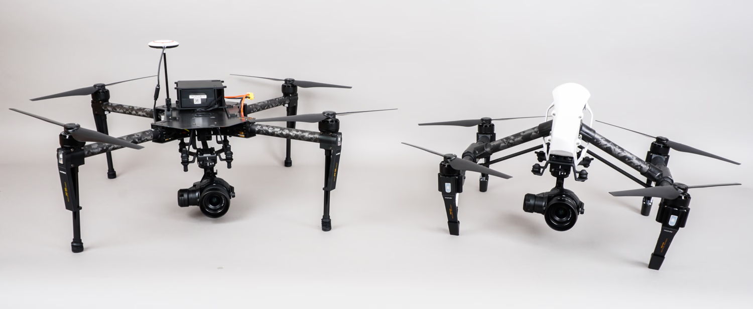 Two drones side by side on a neutral background.