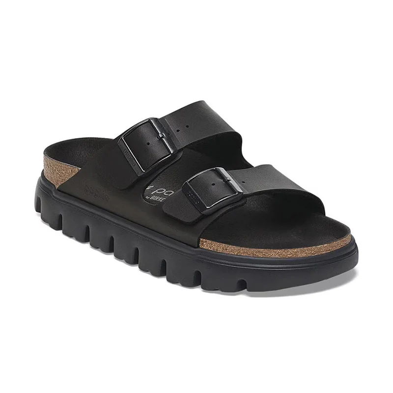 Black slide sandals with two straps and a thick sole.