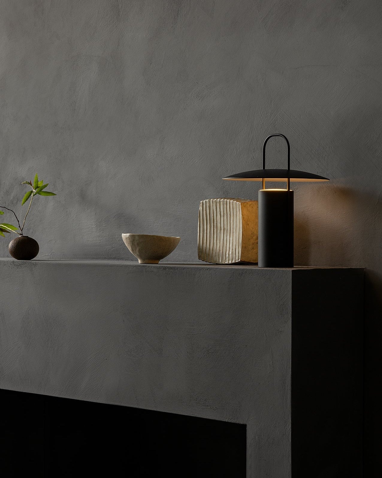 Decorative lamp on a dark surface with a gray background