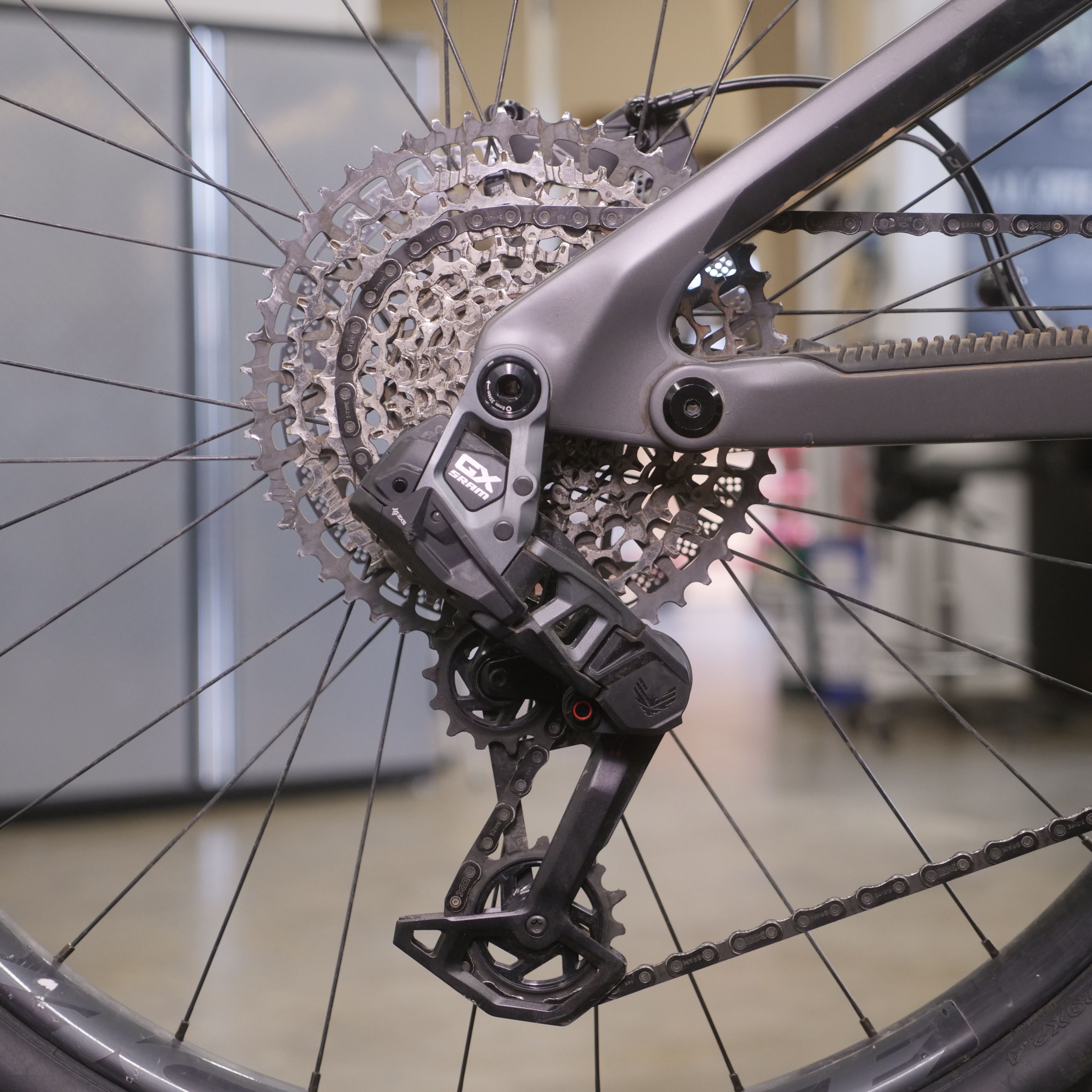Close-up of a bicycle's rear derailleur and cassette.