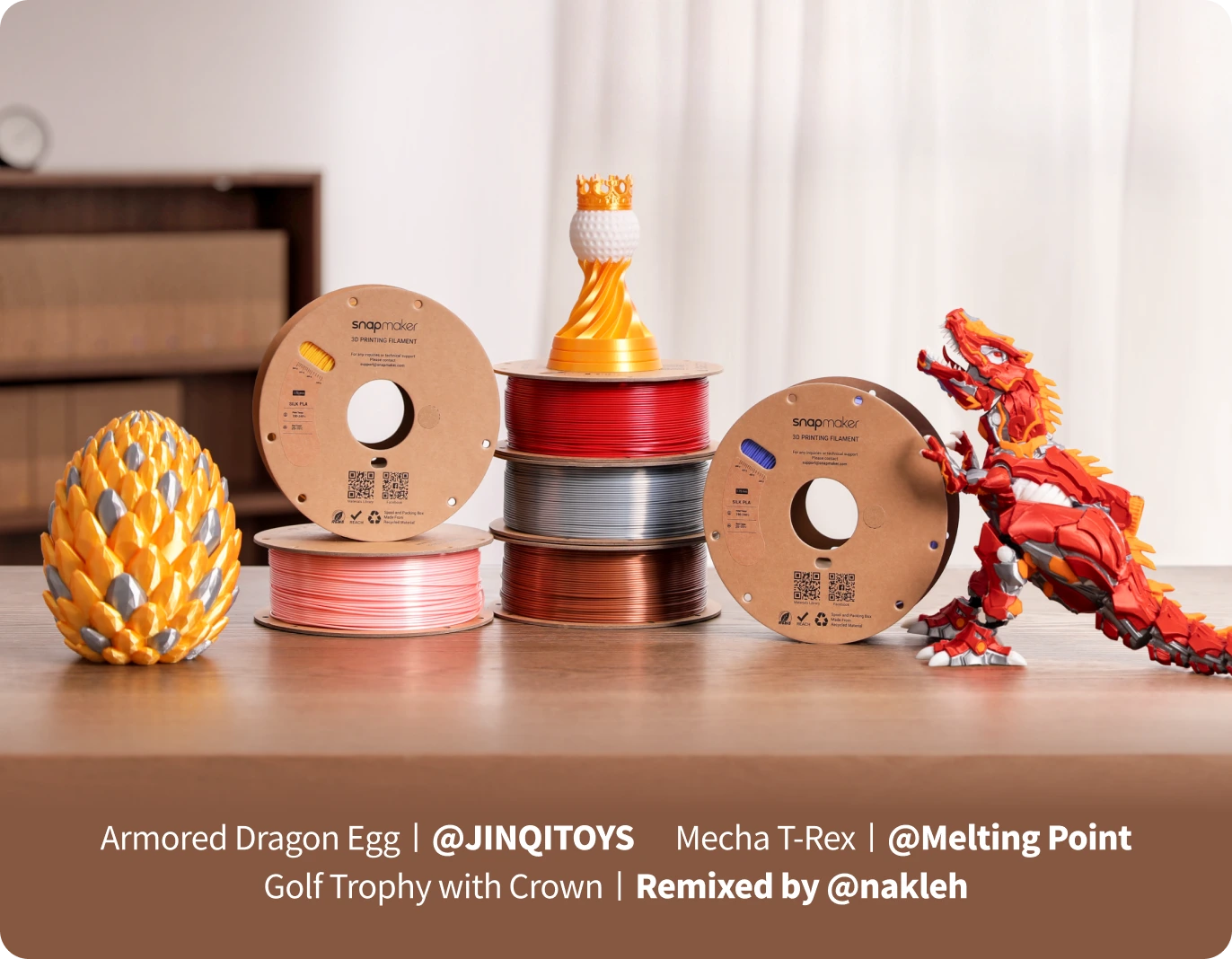 Colorful 3D printed objects and spools of filament on a table.