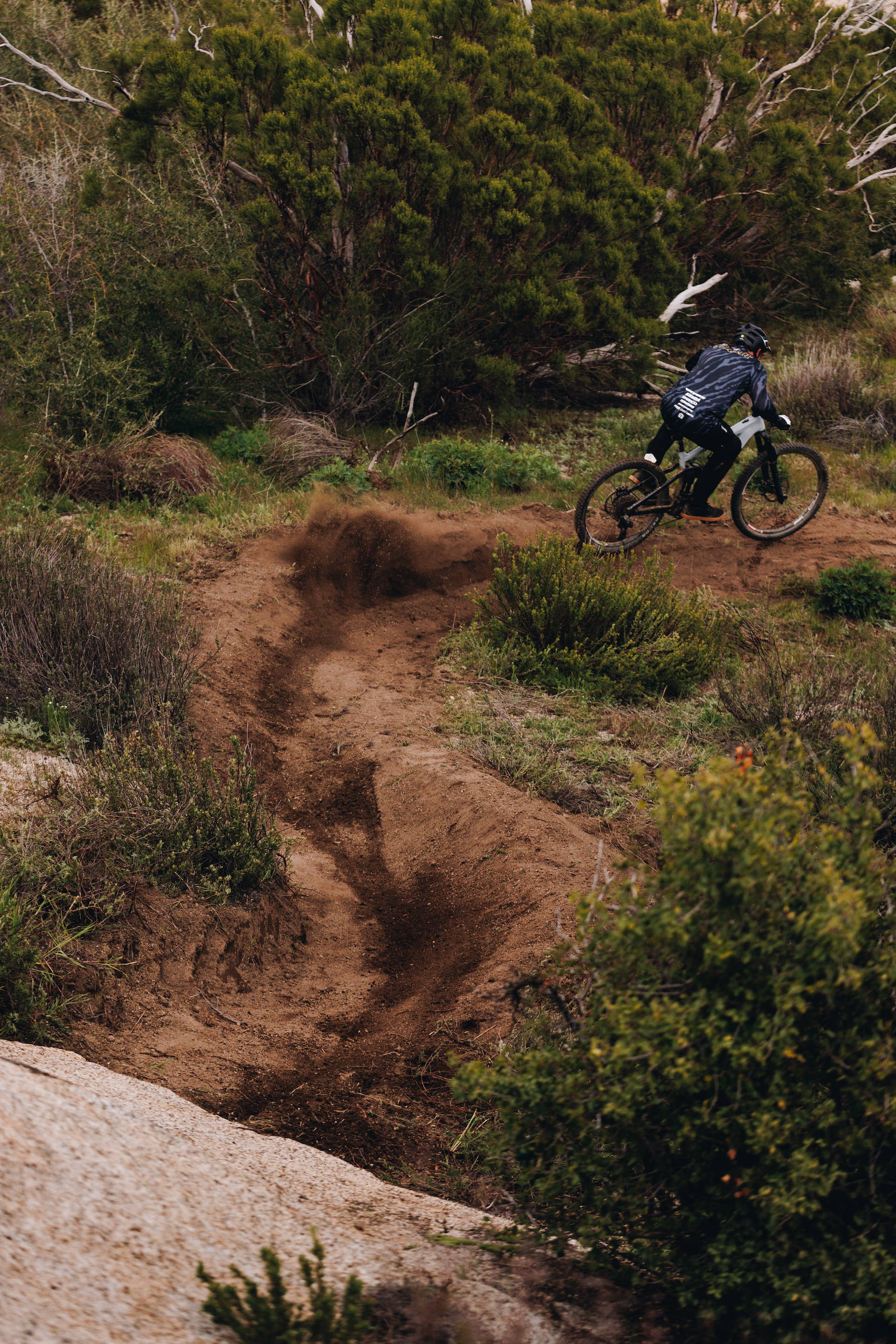 Kyle Strait riding a Vitus E-Sommet mountain bike