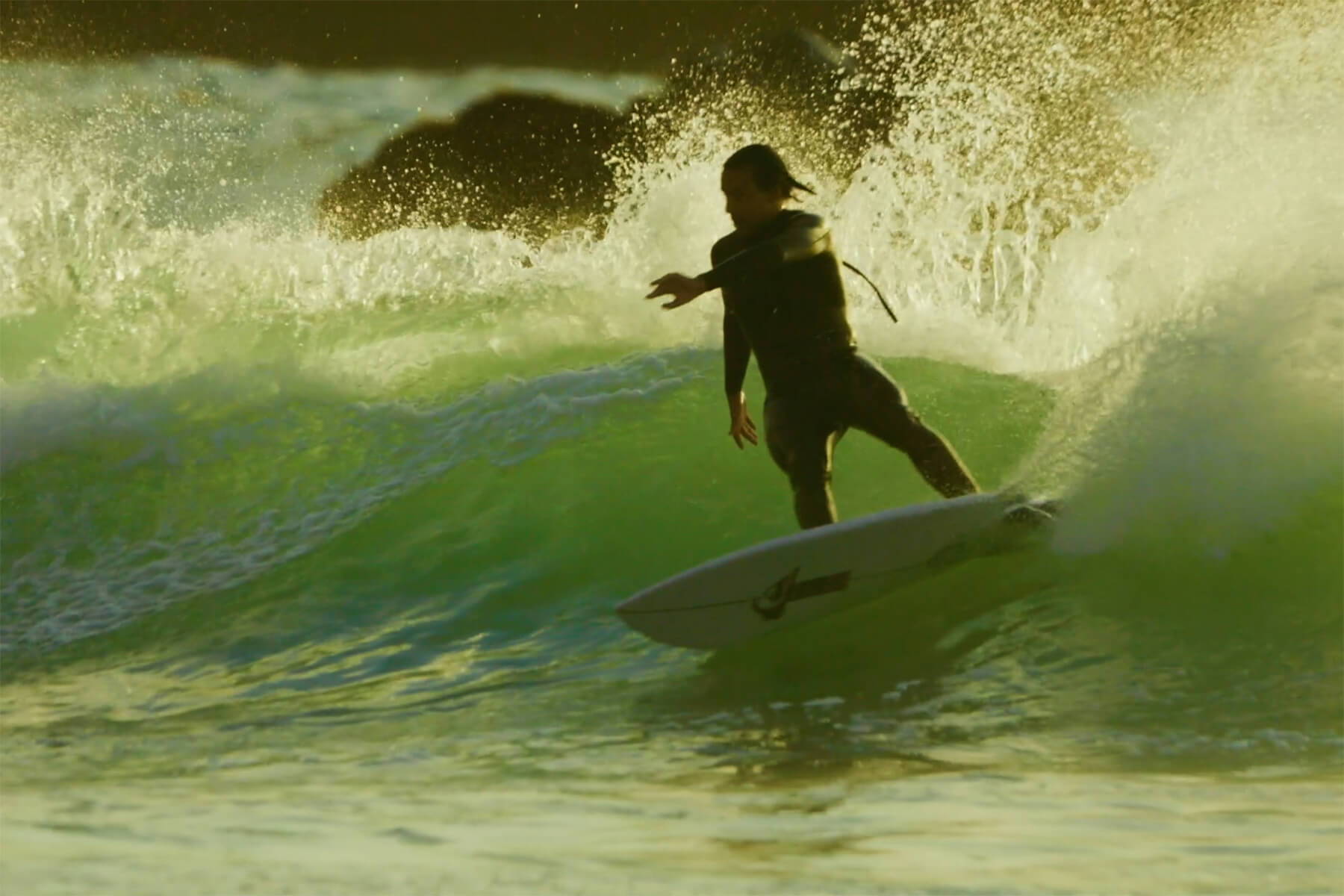Noah Collins surfing