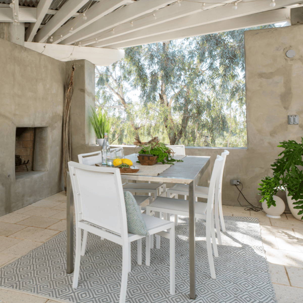 A pastel color palette in this outdoor kitche
