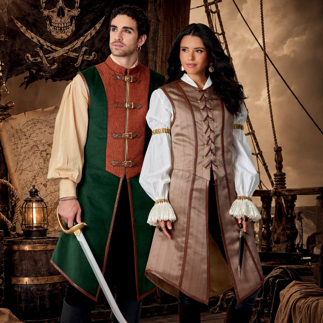 A man and woman in pirate costumes, standing on a ship.