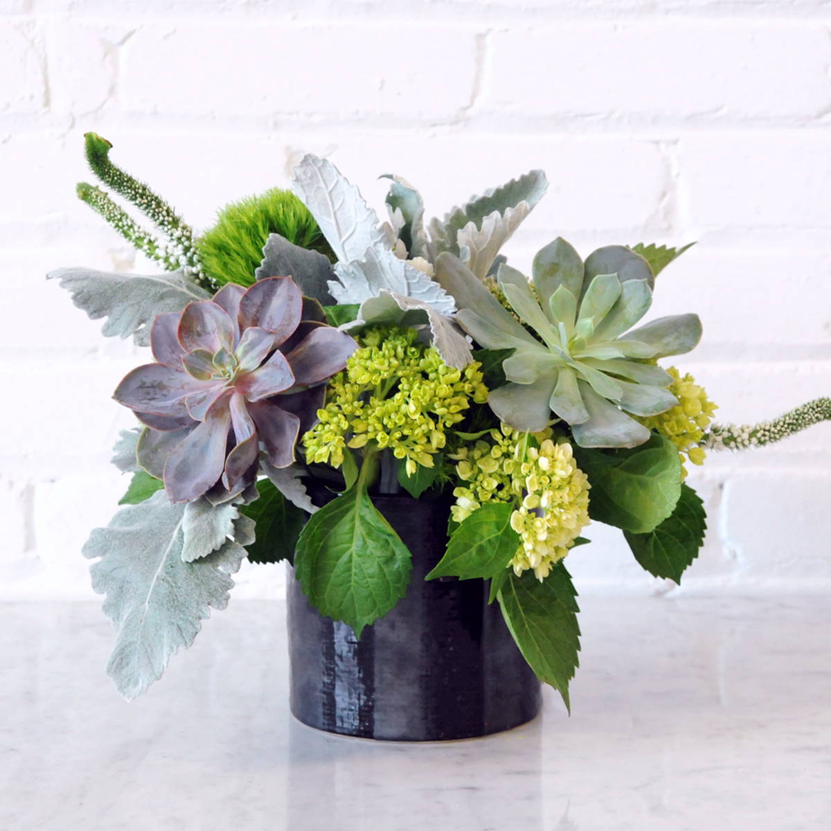 Loring Floral arrangement Monochromatic green with Sedum and silver dusty miller