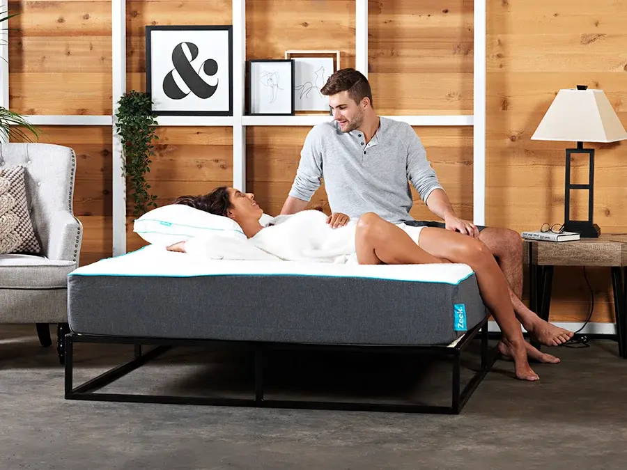 Two people looking at each other lovingly, on a Hybrid Mattress from Zeek.com.au