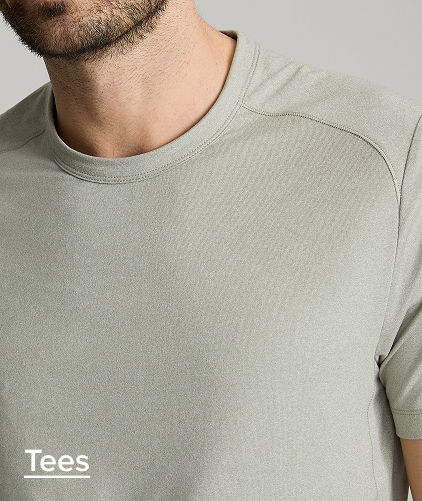 Close-up of a man wearing a light gray t-shirt.