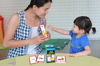 Child playing with First Words flash cards