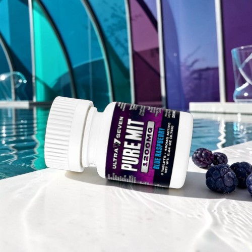 Bottle of Pure Mit supplement beside blueberries by a pool.