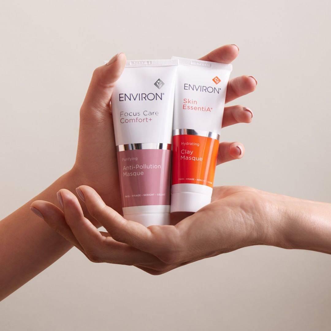 Hands holding Environ Anti-Pollution Masque and Clay Masque