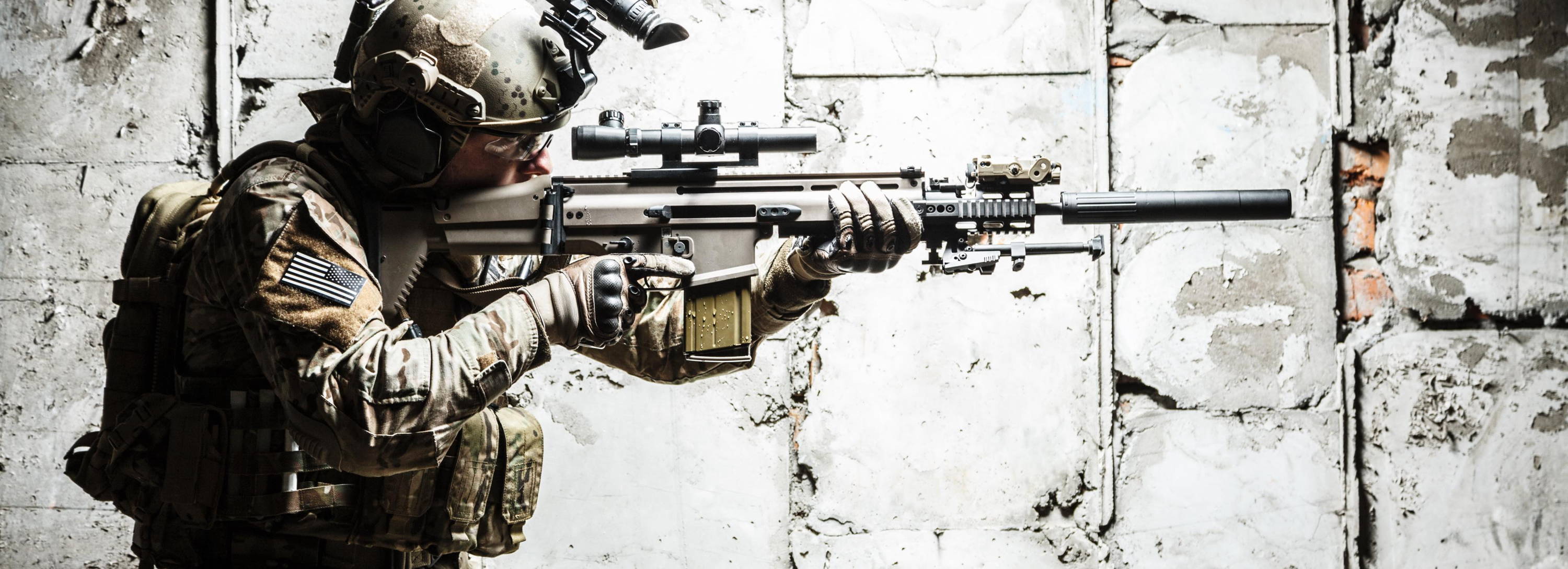 Army Ranger Pointing AR-15 Wearing a Plate Carrier