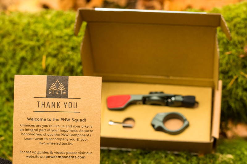 PNW Components Loam Lever on display in the box it comes in with a welcome card