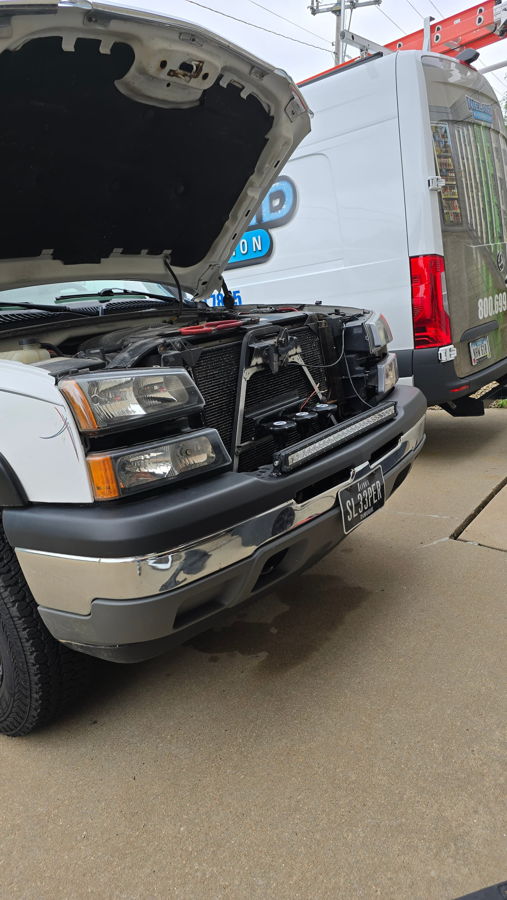 Side profile or angled exterior of Joshua's 2005 Chevy Silverado 1500 showing truck stance and Flatlaw 127H train horn install context, gallery photo 2