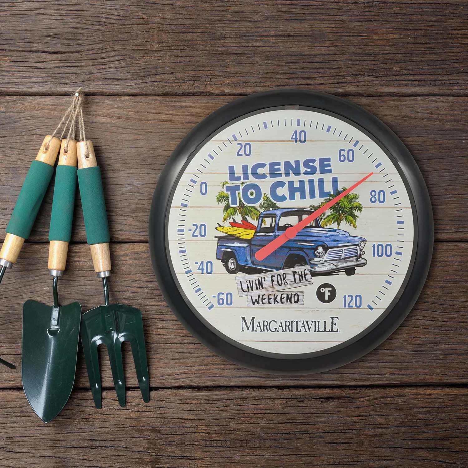 104-134B vintage thermometer with gardening tools, featuring 