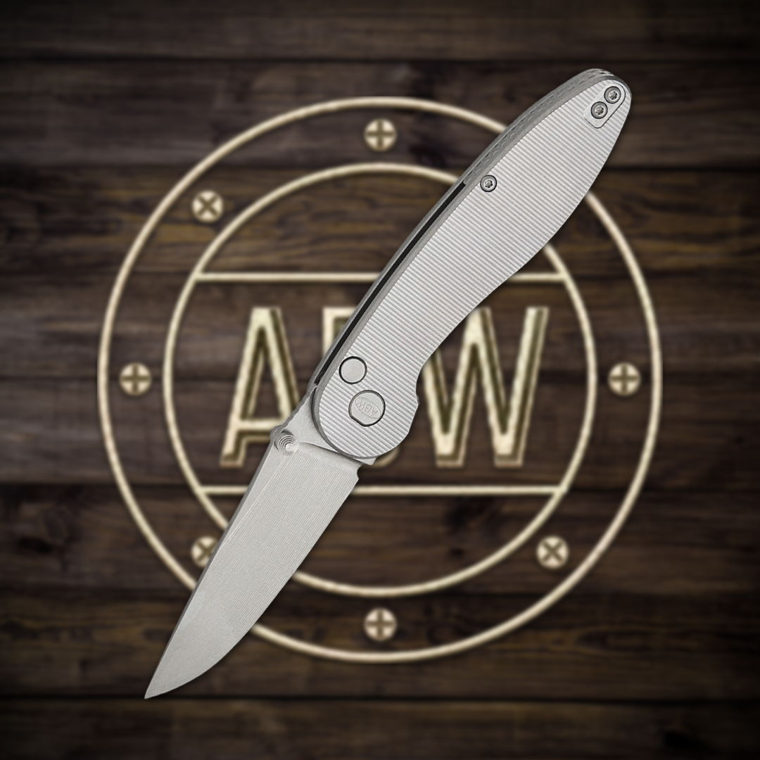 A silver folding knife on a wooden background with a logo.