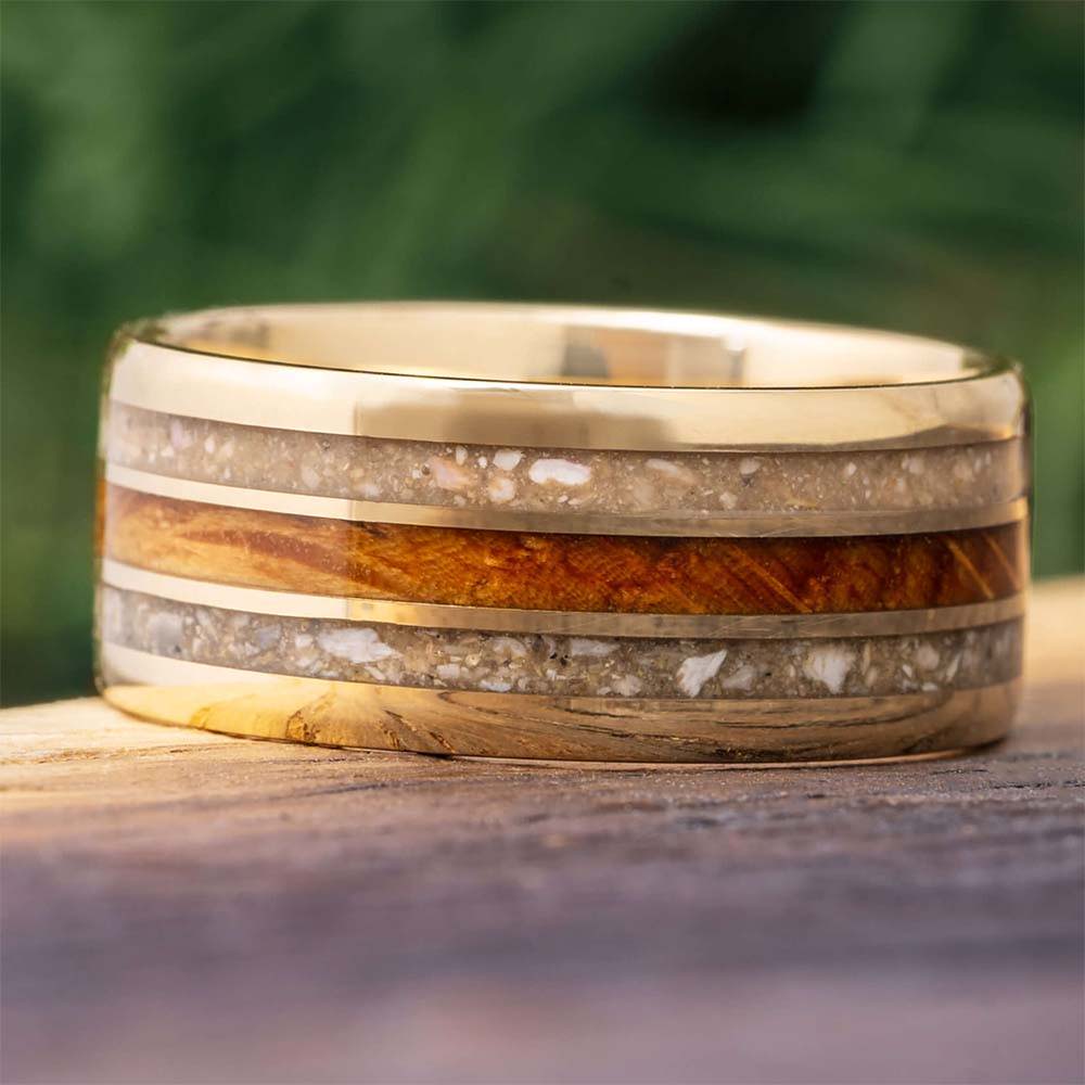 Cremation memorial ring with ash, yellow gold, and wood