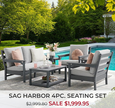 Outdoor seating set by a pool with sale pricing displayed.
