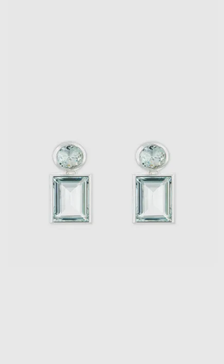 Elegant silver earrings with rectangular and round light blue gemstones.