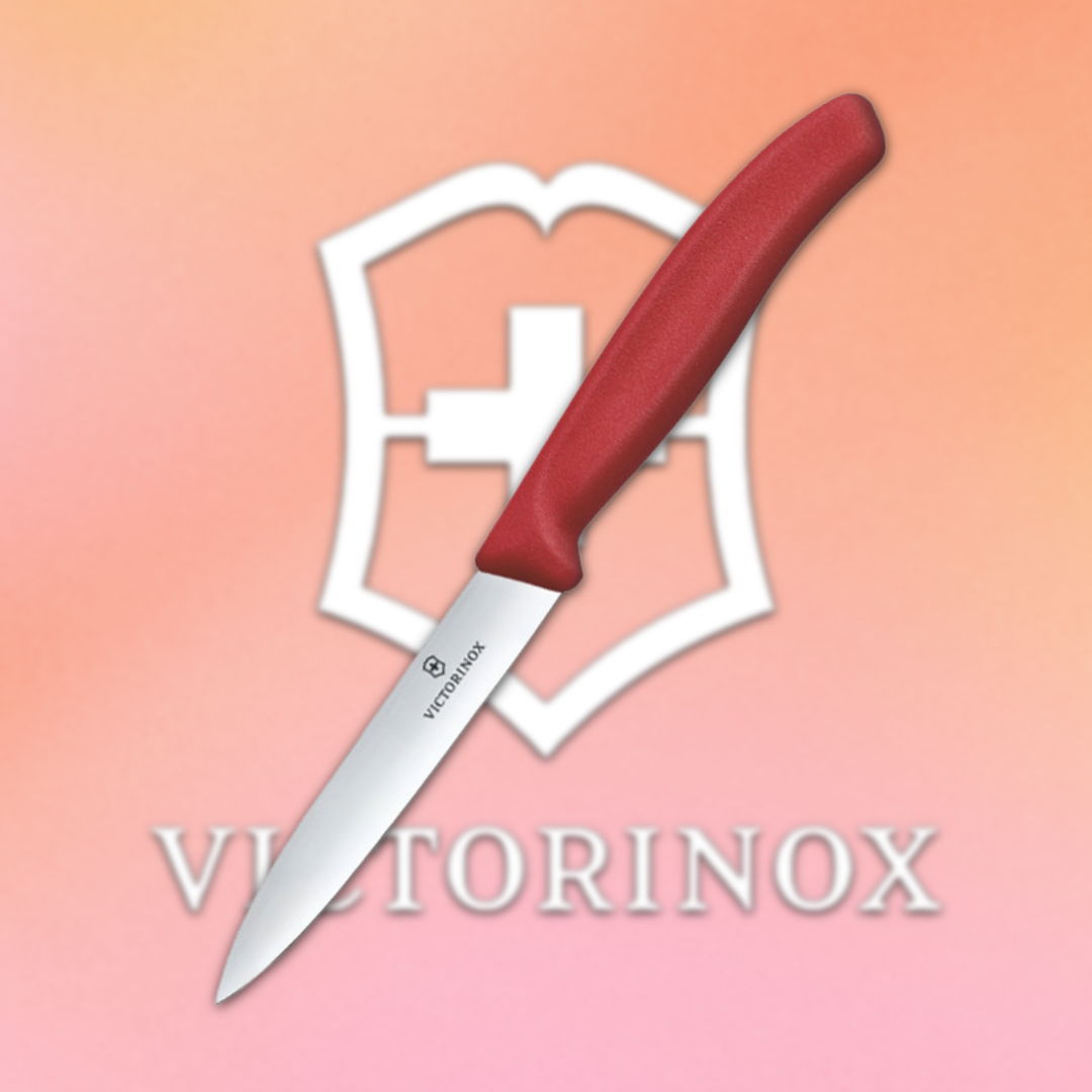 Victorinox knife with a red handle on a gradient background.