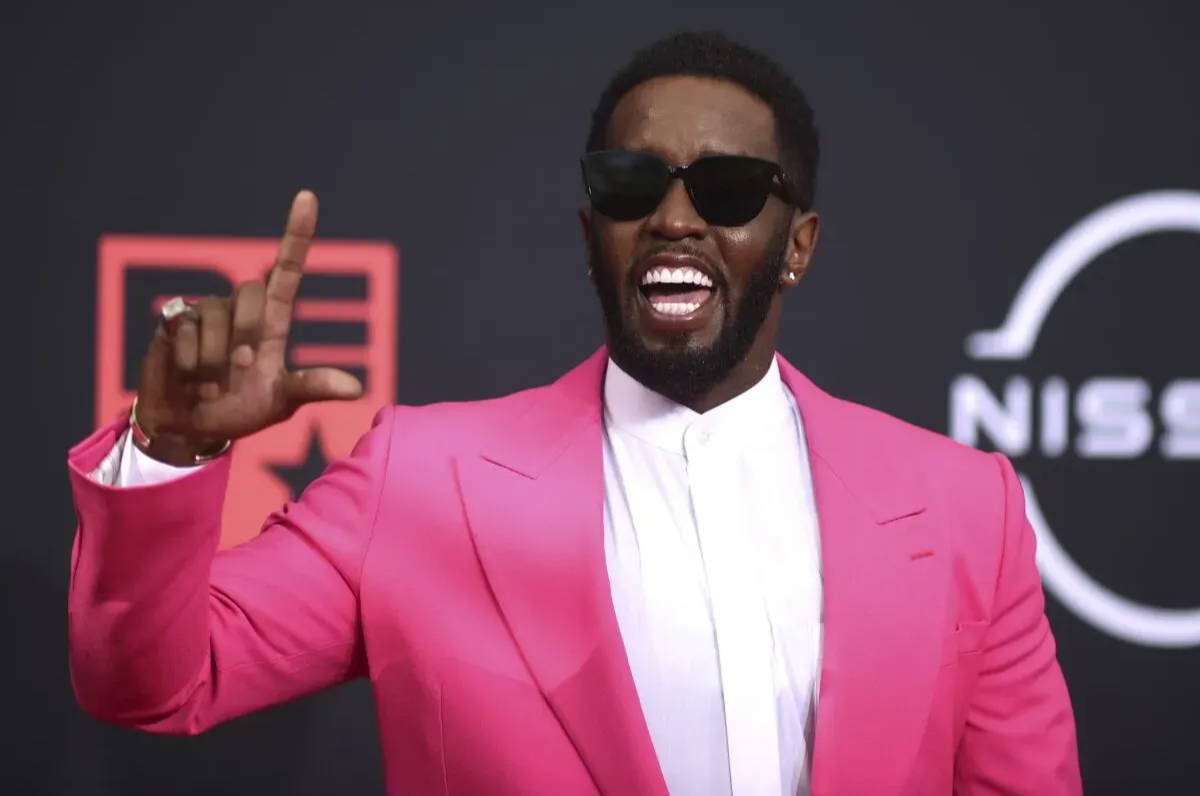 diddy in a pink suit