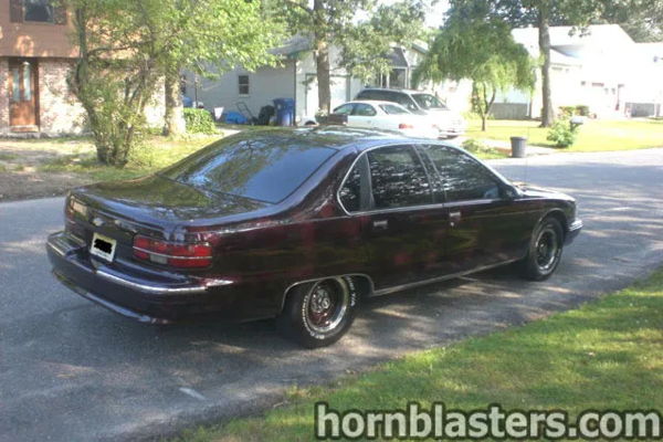 Rear three-quarter maroon Caprice tinted windows black chrome-lip wheels Jack's 1996 Chevy Caprice Conductor's Special 232 train horn kit customer install gallery photo 4