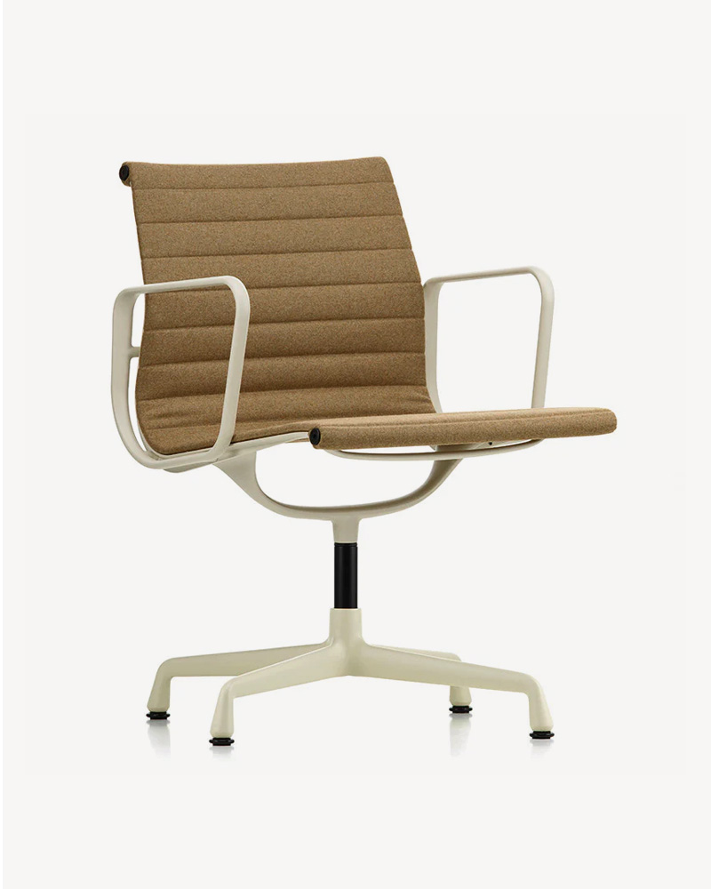 A modern Vitra EA chair with a brown seat and white armrests.