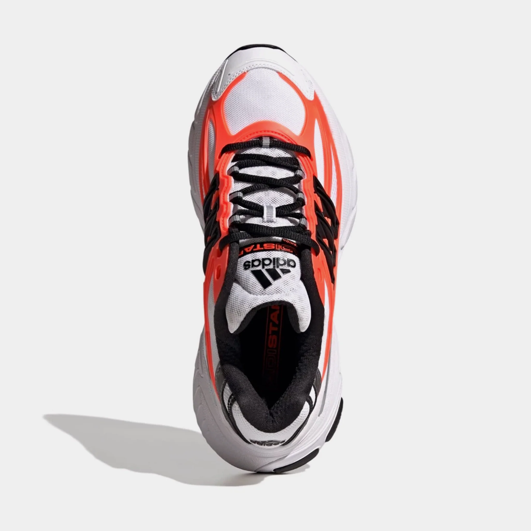 White and orange athletic shoe with black accents and three stripes.