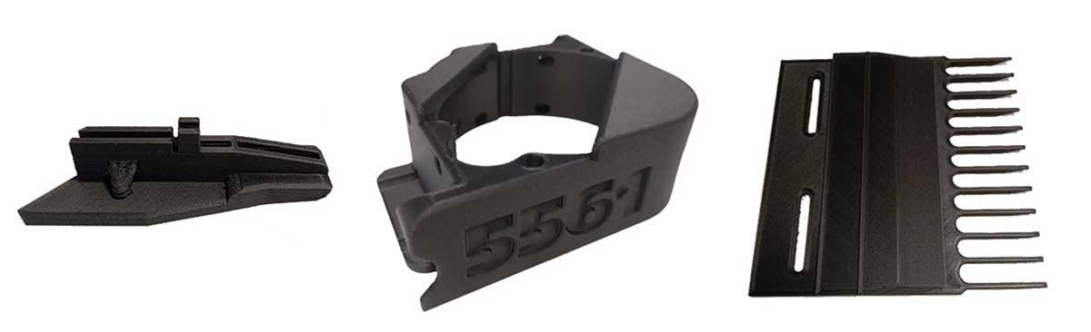 Three black plastic tools or attachments for a device or machine.