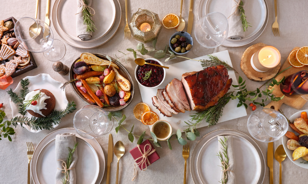 A festive table setting with various dishes and decorations for a celebration.
