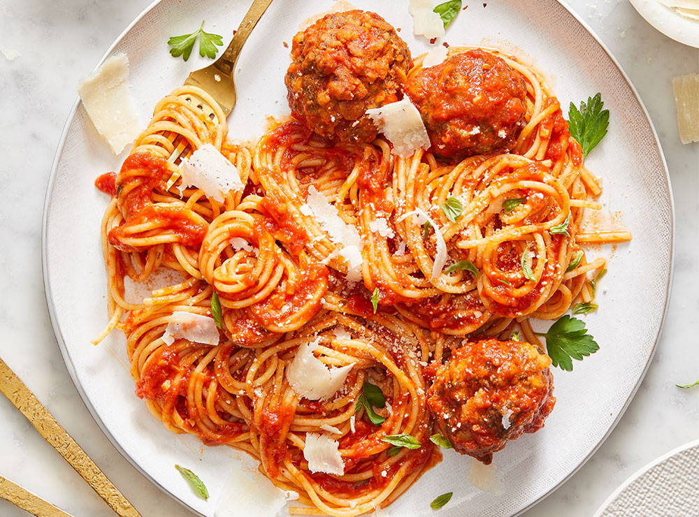 Plate of spaghetti with meatballs in red sauce