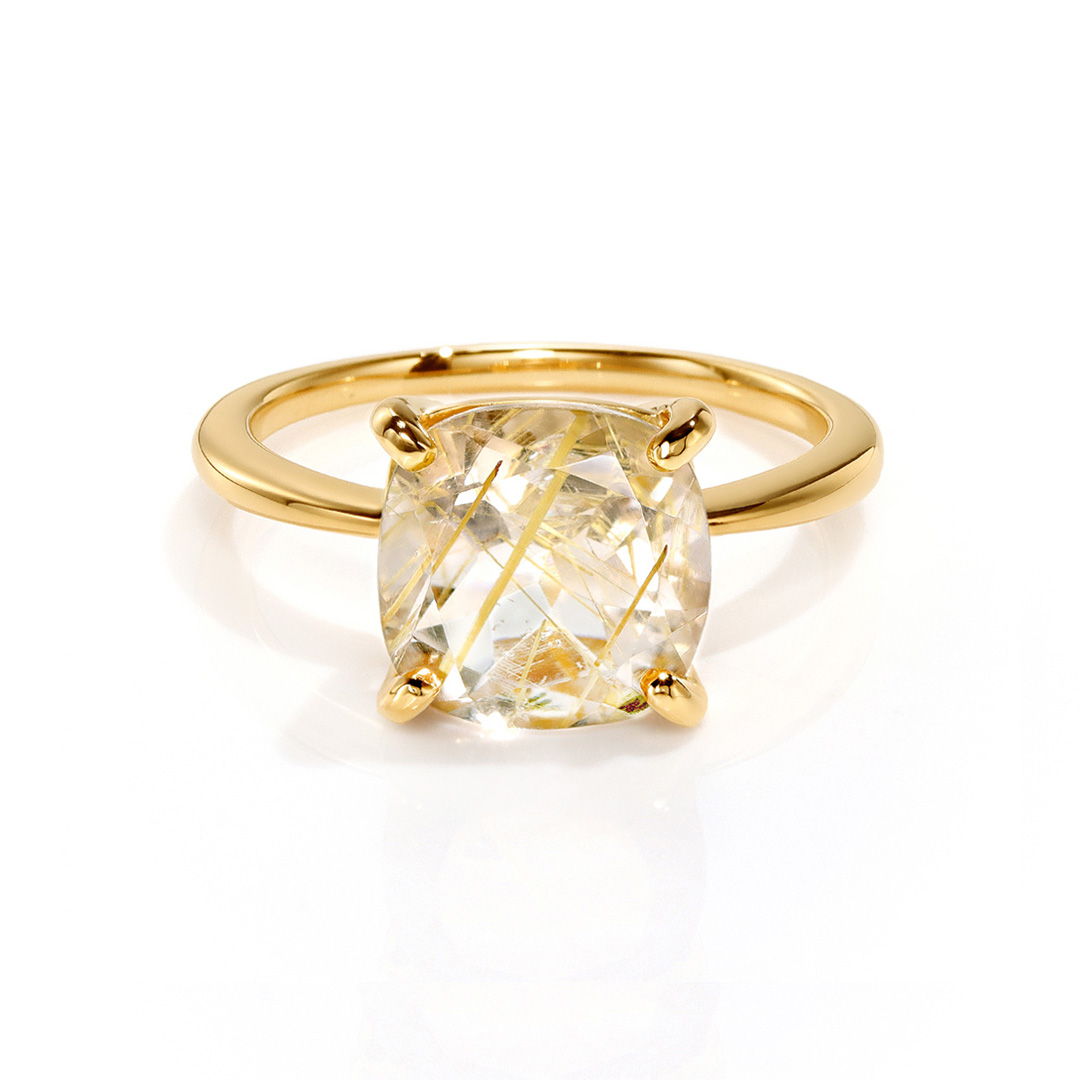 A gold ring featuring a large, cushion-cut diamond.