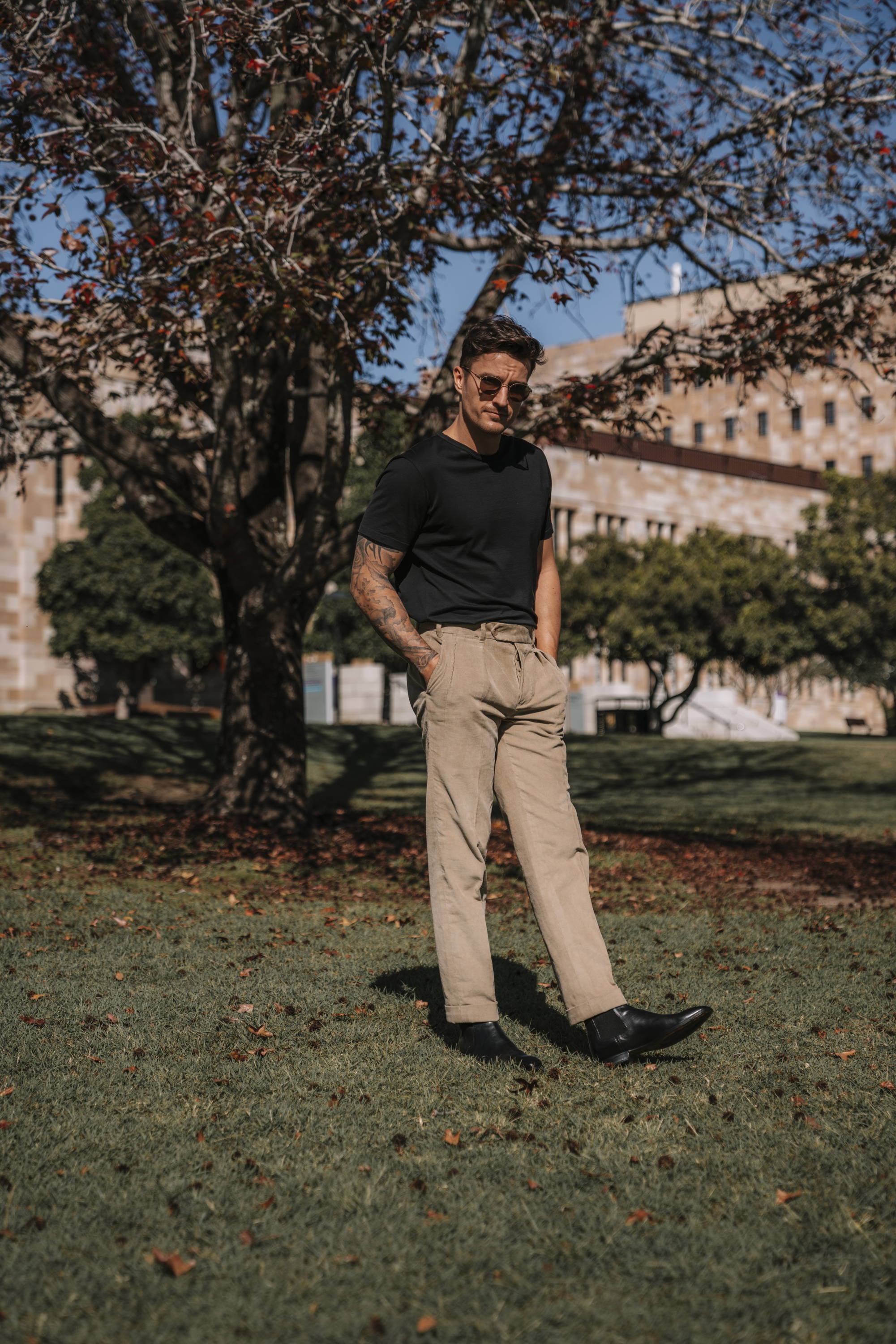 Men's outfit with black Chelsea boots and tailored pants