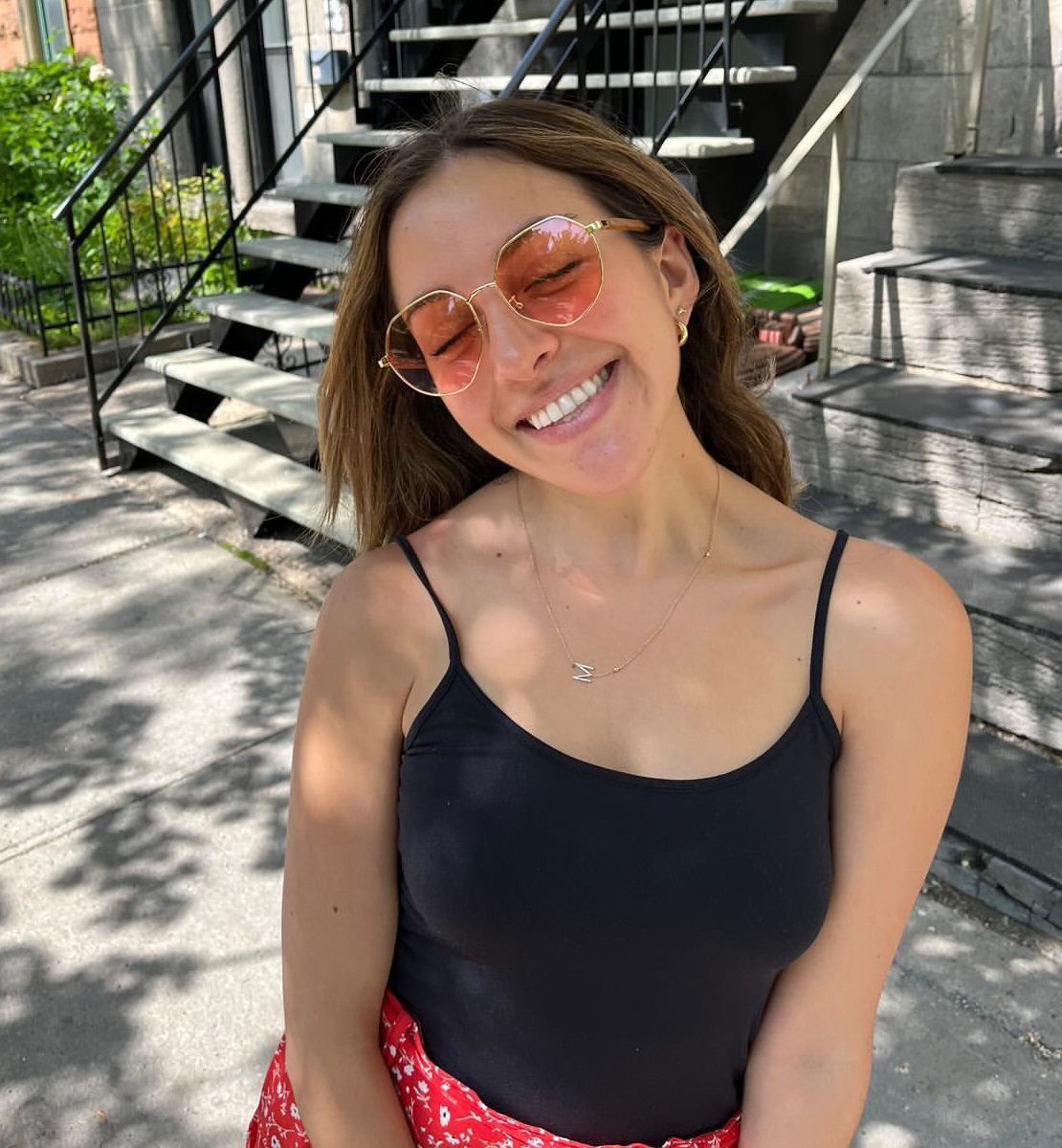 blonde woman wearing Elton, pink hexagon sunglasses