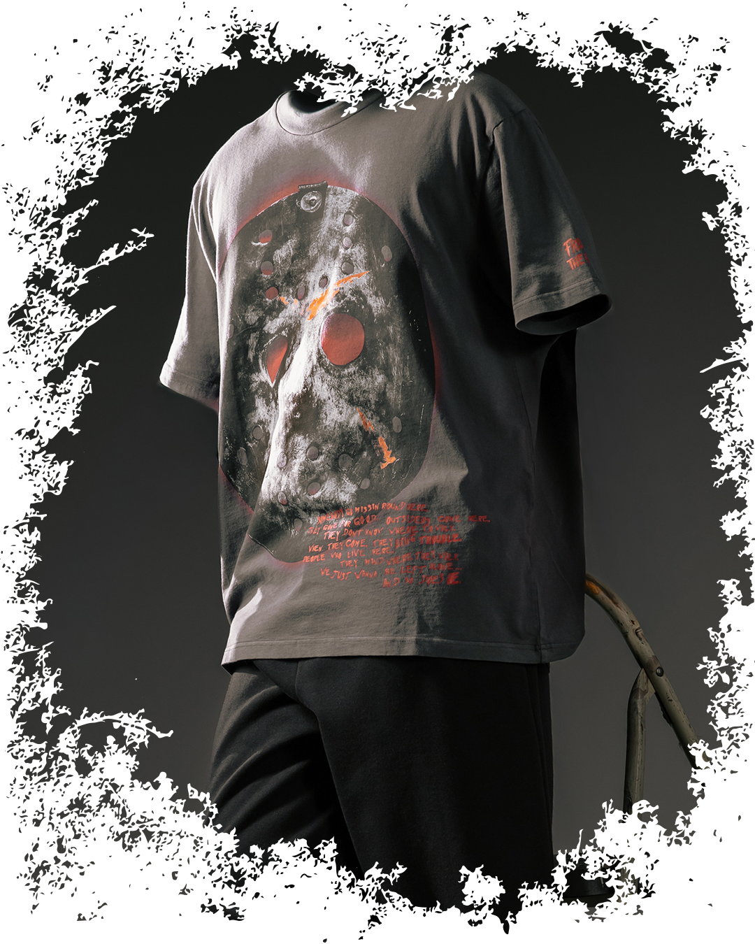 Gray t-shirt with graphic design featuring a skull and abstract elements.