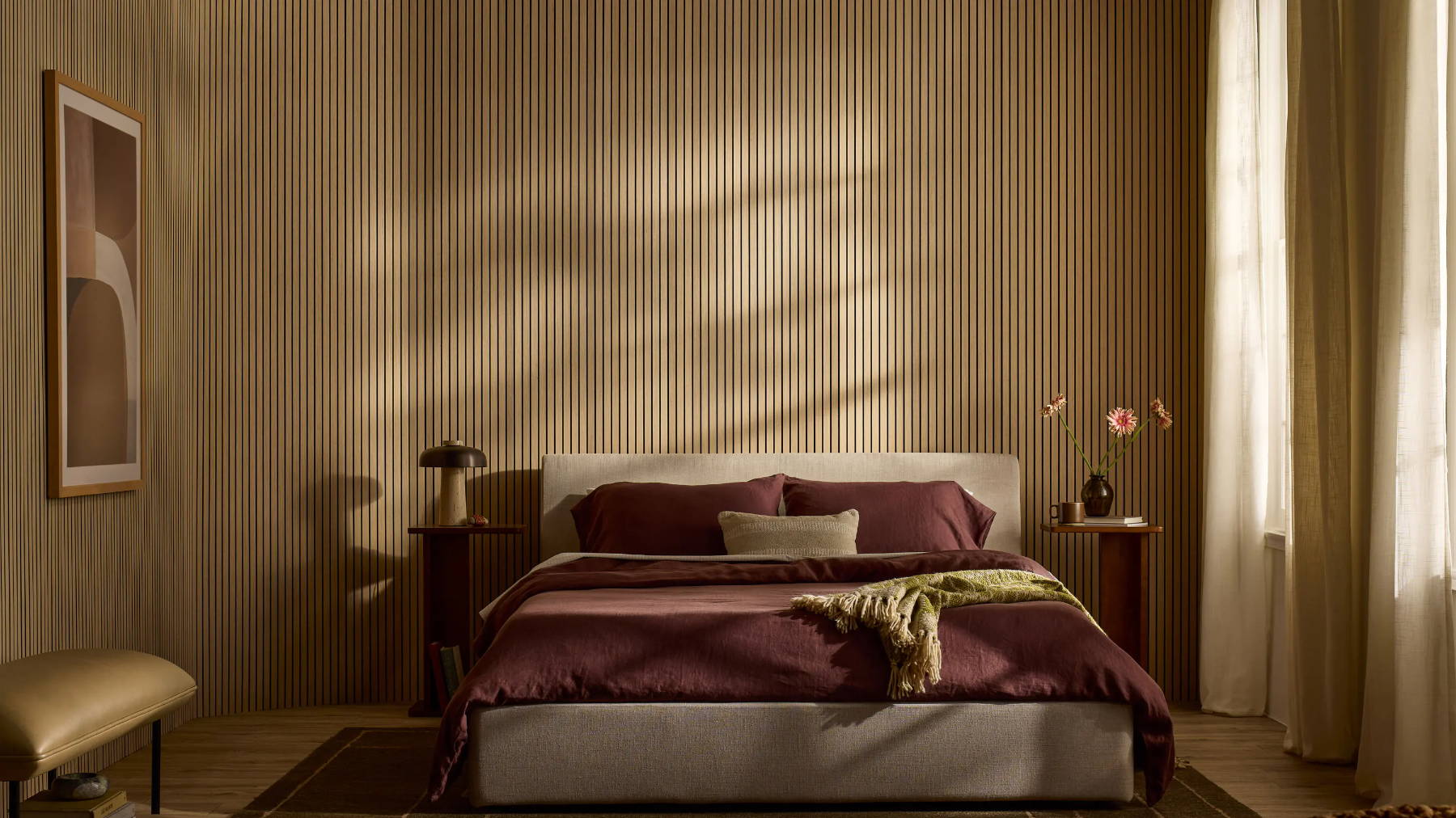 DJH Ultraflex in Oak on a curved wall in a cosy bedroom with a bed, curtains, and warm lighting.