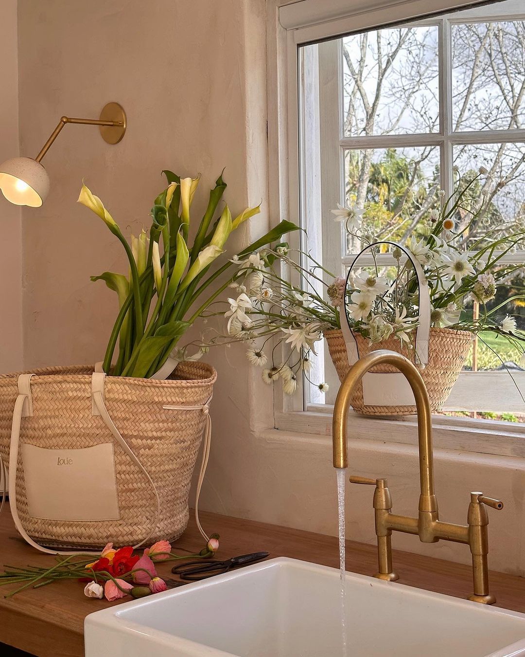 Ceramic Dome Extended Wall Light next to a rustic french style kitchen sink