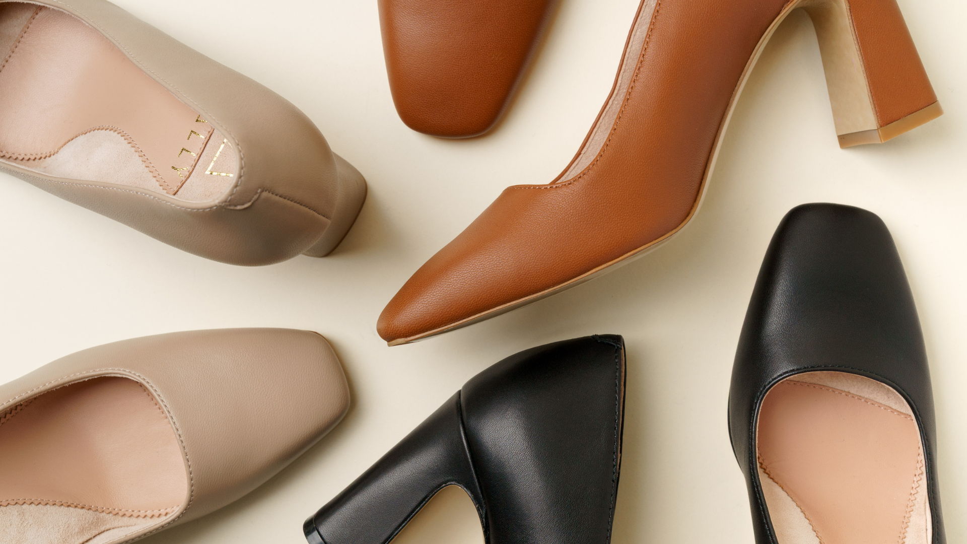 A variety of stylish women's high-heeled shoes in different colors.