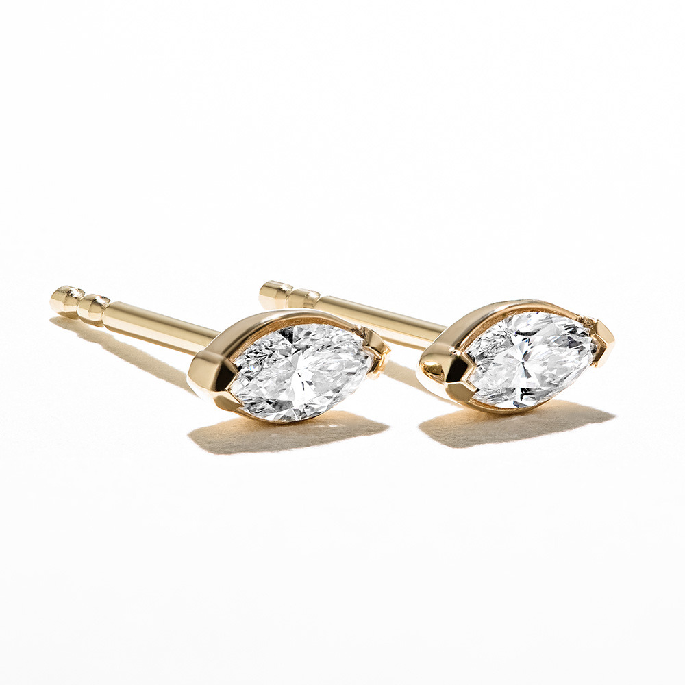 A beautiful pair of marquise cut lab grown diamond stud earrings in 14k rose gold