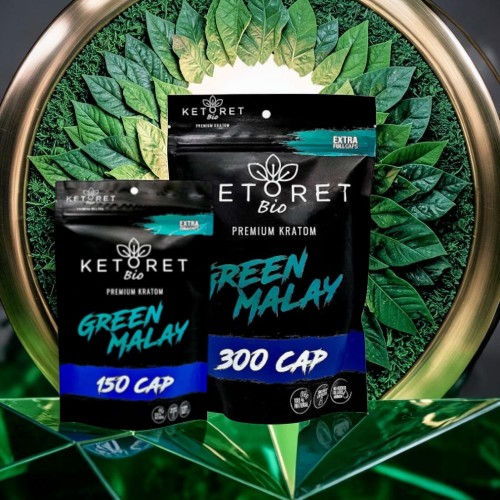 Two packages of Ketoret Green Malay capsules on a decorative background.