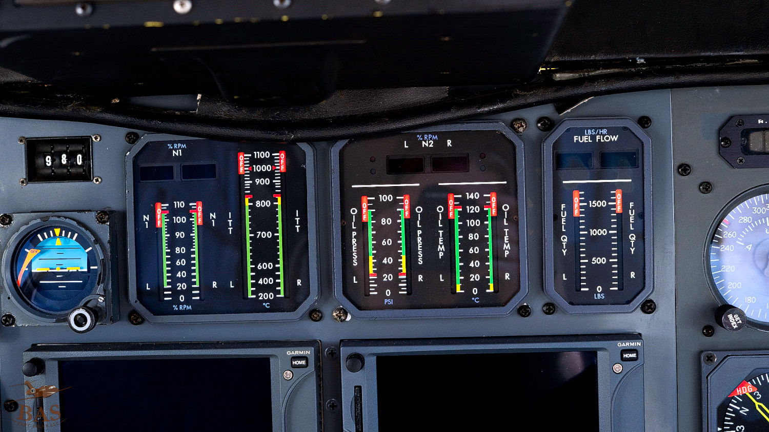 Cockpit instrument panel with various gauges and indicators.