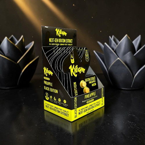 Display of Klutch flavored nicotine pouches with decorative black lotus flowers.