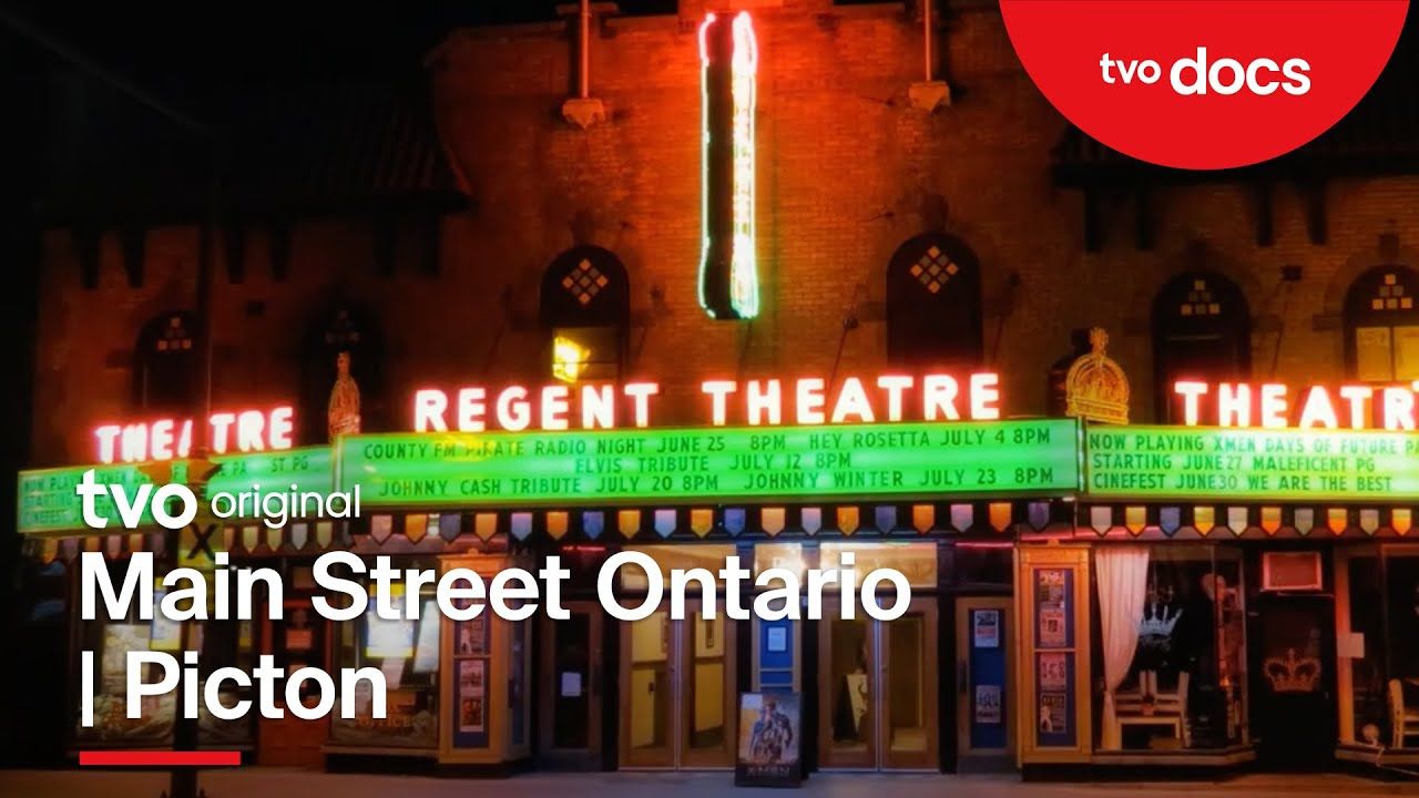 Regent Theatre sign on Main Street, Picton, Ontario, illuminated at night.