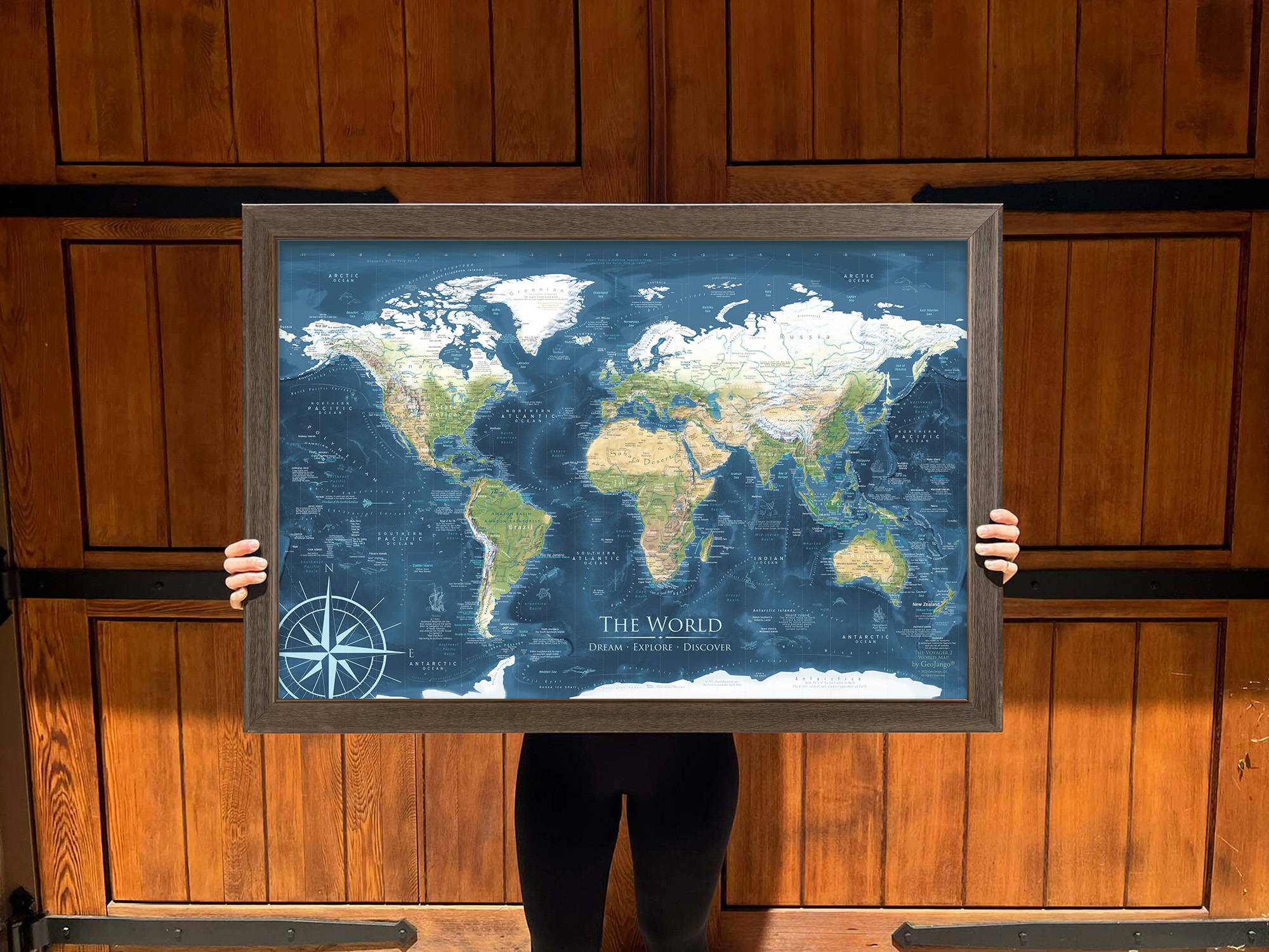Decorative world map with push pins in a frame