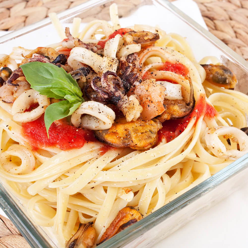 calamari with basil and tomatoes over pasta