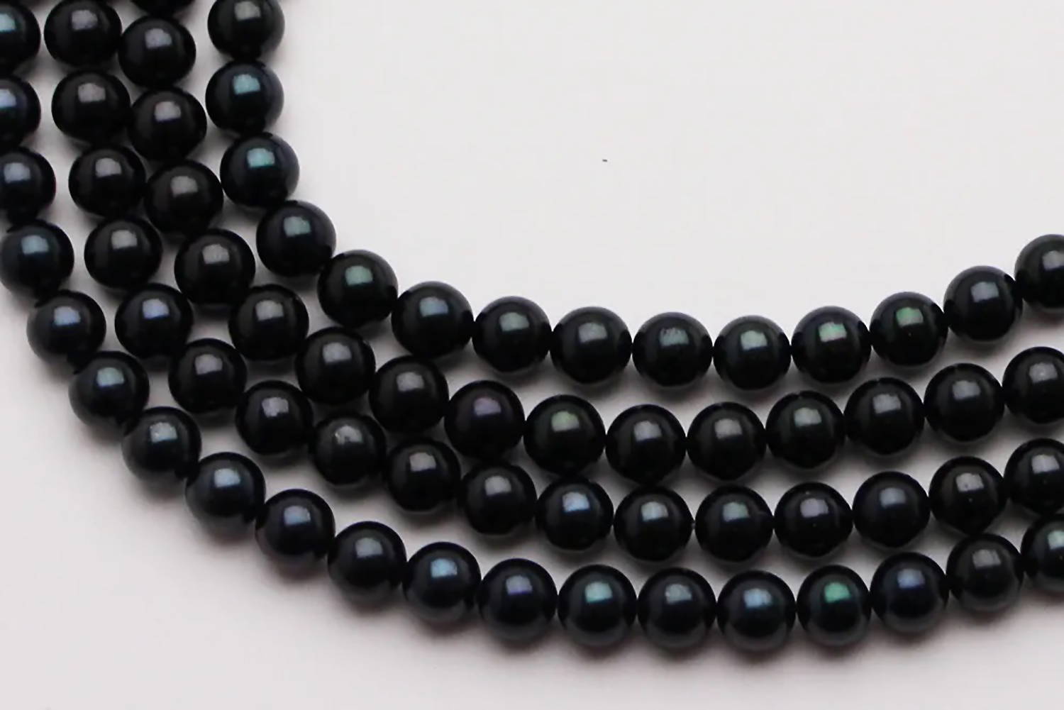 Strands of Black Akoya Pearls