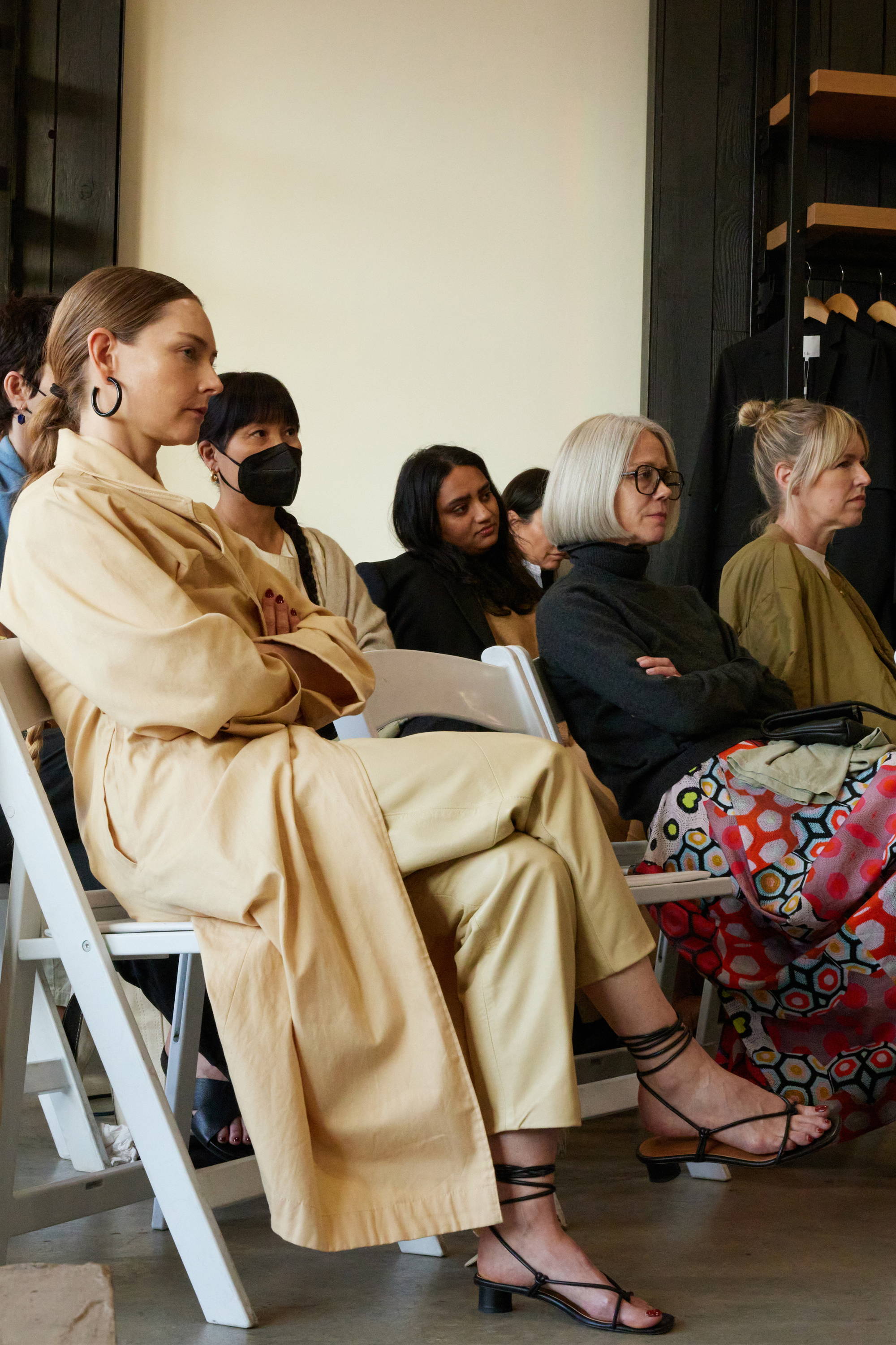 A group of people sitting attentively in a seminar or meeting.