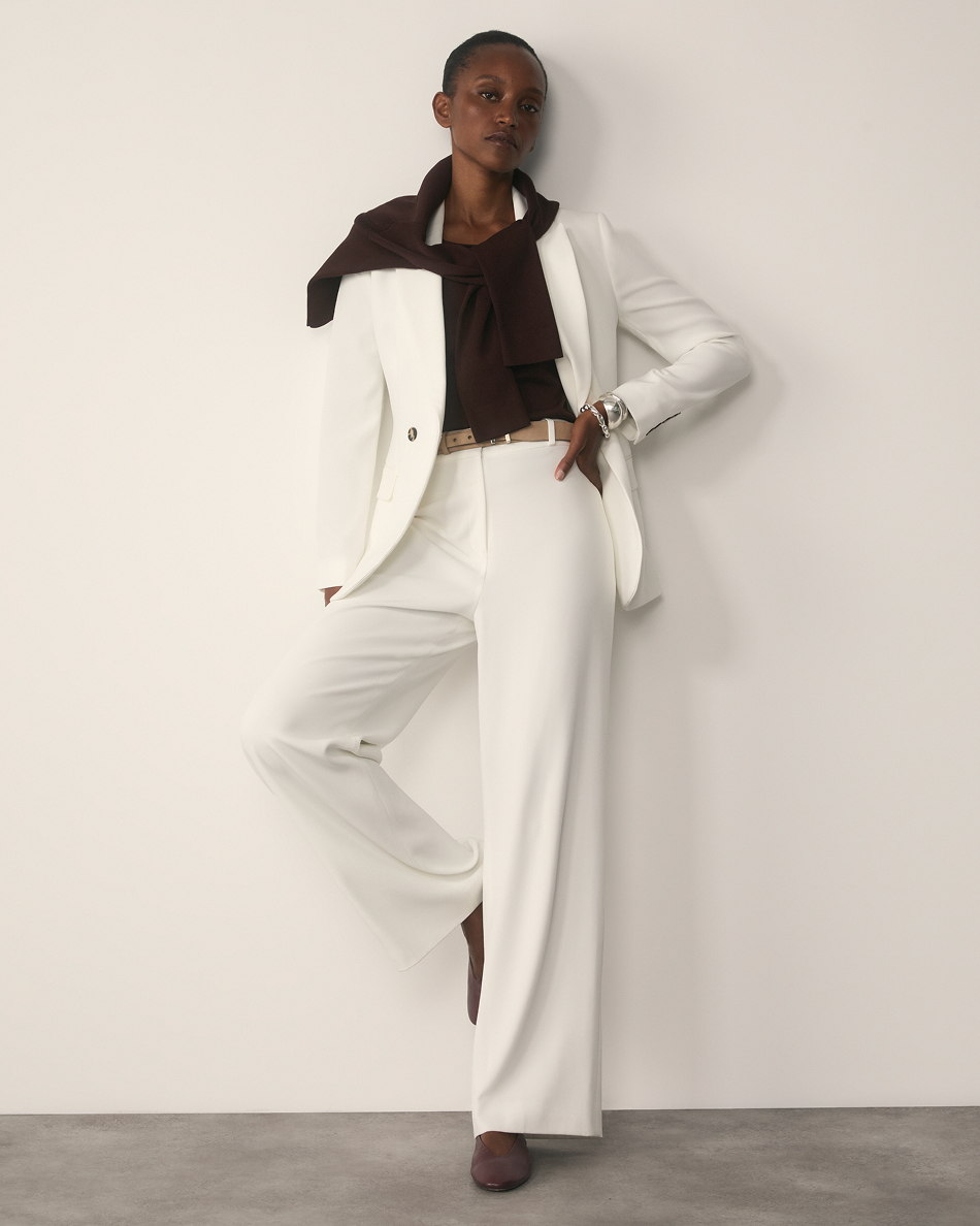 A model wearing Ivory Clever Crepe suiting